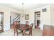 Traditional dining room featuring hardwood floors, decorative wainscoting, and a chandelier at 14626 Warner Trl, Westfield, IN 46074