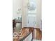 Grand foyer with hardwood floors, chandelier, and arched window providing natural light at 14626 Warner Trl, Westfield, IN 46074