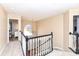 Upstairs hallway landing featuring a front door view, stairway, and chandelier at 14626 Warner Trl, Westfield, IN 46074