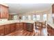 Open kitchen with granite countertops, wood floors, stainless steel appliances and dining area at 14626 Warner Trl, Westfield, IN 46074