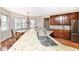 Large granite island and wood cabinets in this kitchen make a beautiful spot to cook at 14626 Warner Trl, Westfield, IN 46074