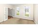 A living room with an open doorway and two windows at 14626 Warner Trl, Westfield, IN 46074
