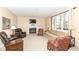 Comfortable living room with a fireplace, plush seating, and large window at 14626 Warner Trl, Westfield, IN 46074