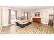 Spacious bedroom with wood floors, two windows, dresser, and artwork creating a comfortable retreat at 14626 Warner Trl, Westfield, IN 46074