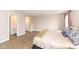 Bright main bedroom with wood floors, open to a bathroom and closet creating a seamless, modern feel at 14626 Warner Trl, Westfield, IN 46074