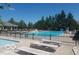 Community pool with ample lounge chairs and umbrellas, perfect for relaxing and enjoying the summer sun at 14626 Warner Trl, Westfield, IN 46074
