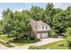 Two car garage and basketball court are seen from this rear exterior shot of the home at 14626 Warner Trl, Westfield, IN 46074