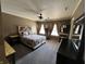Bedroom with a unique wood headboard, ceiling fan and natural lighting at 5656 Buck Dr, Noblesville, IN 46062