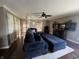 Spacious living room with a plush sectional sofa, ceiling fan, and media center at 5656 Buck Dr, Noblesville, IN 46062