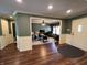 View of the front entry and a living room, featuring hardwood floors and white moldings throughout at 5656 Buck Dr, Noblesville, IN 46062