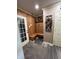 Welcoming mud room with convenient bench seating, storage hooks, and stylish wood paneling for organized entry at 5656 Buck Dr, Noblesville, IN 46062