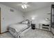Bright bedroom with a bed, ceiling fan, and a desk for working or studying from home at 1487 Brook Mill Ct, Carmel, IN 46032