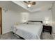 Neutral bedroom features a ceiling fan, side tables and a queen-sized bed with throw blanket at 1487 Brook Mill Ct, Carmel, IN 46032