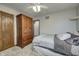Bedroom featuring carpeted floors, a ceiling fan, and a closet for added storage at 1487 Brook Mill Ct, Carmel, IN 46032