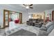 Open living area with access to a sunroom, luxury vinyl plank flooring, and cozy seating at 1487 Brook Mill Ct, Carmel, IN 46032