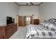 Spacious bedroom with large dressers, ceiling fan, and direct access to the outdoors at 1487 Brook Mill Ct, Carmel, IN 46032