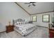 Inviting bedroom with vaulted ceiling, ceiling fan, and plush carpeting at 1487 Brook Mill Ct, Carmel, IN 46032