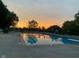 Community pool at sunset, offering a refreshing and scenic spot for relaxation and recreation at 1487 Brook Mill Ct, Carmel, IN 46032