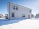 Two story home with backyard covered in snow at 1420 Chime Ln, Greenwood, IN 46143