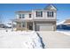 Two-story house with gray siding, brick accents, and a two-car garage at 1420 Chime Ln, Greenwood, IN 46143