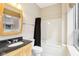 Bathroom with tub/shower combo, tile flooring, and stylish vanity and mirror at 350 N Meridian St # 901, Indianapolis, IN 46204