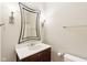 Bathroom vanity with granite countertop, modern fixtures, and custom mirror at 350 N Meridian St # 901, Indianapolis, IN 46204
