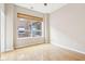 This bedroom features hardwood floors and a large window with views at 350 N Meridian St # 901, Indianapolis, IN 46204