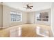 Bright bedroom with hardwood floors, a ceiling fan and large windows at 350 N Meridian St # 901, Indianapolis, IN 46204