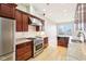 Gourmet kitchen featuring stainless steel appliances, granite countertops, and custom cabinetry at 350 N Meridian St # 901, Indianapolis, IN 46204