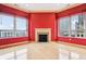 Spacious living room with a fireplace, large windows and hardwood floors at 350 N Meridian St # 901, Indianapolis, IN 46204