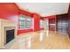 Spacious living room with built-in shelving, fireplace, large windows and hardwood floors at 350 N Meridian St # 901, Indianapolis, IN 46204