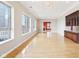 Open living room with hardwood flooring, a fireplace, and city views through large windows at 350 N Meridian St # 901, Indianapolis, IN 46204