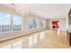 Bright living room boasts wood floors, fireplace, and cityscape views through expansive windows at 350 N Meridian St # 901, Indianapolis, IN 46204