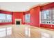 Spacious living room with a fireplace, large windows and hardwood floors at 350 N Meridian St # 901, Indianapolis, IN 46204