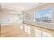 Bright living area with hardwood floors and large windows offering stunning views of the city at 350 N Meridian St # 901, Indianapolis, IN 46204