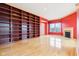 Spacious living room with built-in shelving, fireplace, large windows and hardwood floors at 350 N Meridian St # 901, Indianapolis, IN 46204