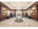 Elegant lobby features marble floors, wood paneled walls, a decorative ceiling, and crystal chandelier at 350 N Meridian St # 901, Indianapolis, IN 46204