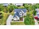 Two-story house with gray roof, landscaping, and driveway at 11419 Romeo Pl, Fishers, IN 46040