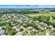 Neighborhood view, showcasing a two-story house and pond at 11419 Romeo Pl, Fishers, IN 46040