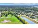 Neighborhood view showcasing a two story house near a pond and park at 11419 Romeo Pl, Fishers, IN 46040