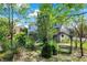 Serene backyard with garden, bench, and lush landscaping at 11419 Romeo Pl, Fishers, IN 46040