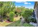 Landscaped backyard with lush greenery and mature trees at 11419 Romeo Pl, Fishers, IN 46040