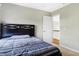 Small bedroom with a double bed and access to the upstairs loft at 11419 Romeo Pl, Fishers, IN 46040