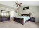 Primary bedroom with high ceilings, a large bed, and plenty of natural light at 11419 Romeo Pl, Fishers, IN 46040