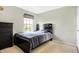 Neutral bedroom with a double bed, dresser, and large window at 11419 Romeo Pl, Fishers, IN 46040