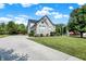 Brick two-story house with a landscaped lawn and driveway at 11419 Romeo Pl, Fishers, IN 46040