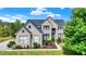 Brick two-story house with landscaped yard and large driveway at 11419 Romeo Pl, Fishers, IN 46040