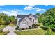 Brick two-story house with landscaped lawn and driveway at 11419 Romeo Pl, Fishers, IN 46040