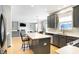 Modern kitchen with gray cabinets, white countertops, and stainless steel appliances at 11419 Romeo Pl, Fishers, IN 46040