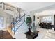 Open concept living room and dining area with view of staircase at 11419 Romeo Pl, Fishers, IN 46040